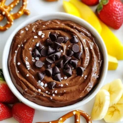 To make delightful brownie batter hummus, you need a few simple ingredients. Each item adds to the rich taste. Here’s what you will need: - Chickpeas - Almond Butter - Cocoa Powder - Maple Syrup or Honey - Vanilla Extract - Sea Salt - Almond Milk - Dark Chocolate Chips Chickpeas form the base. They provide protein and smoothness. Almond butter adds a nutty flavor and creaminess. Cocoa powder gives that rich chocolate taste. Maple syrup or honey sweetens the mix. Vanilla extract enhances the overall flavor. Sea salt balances the sweetness and heightens taste. Almond milk helps you achieve the perfect texture. Dark chocolate chips add fun bursts of chocolate in every bite. This blend is both tasty and healthy. It’s a fun treat that you can enjoy anytime! {{ingredient_image_2}} Start by draining and rinsing one can of chickpeas. This step is key. Rinsing helps remove the canning liquid. It also reduces the beany taste. Place the chickpeas in your food processor. Make sure they are ready for blending. Add the following ingredients to the food processor: - 1/2 cup smooth almond butter - 1/4 cup unsweetened cocoa powder - 1/4 cup pure maple syrup or honey - 1 teaspoon vanilla extract - 1/4 teaspoon fine sea salt Blend these ingredients until they are smooth. Stop to scrape down the bowl. This helps mix everything well. Now, add 2 to 4 tablespoons of almond milk. Pour it in one tablespoon at a time. Blend after each addition. Keep blending until you get the right texture. You want it creamy. Thicker is great for spreading. Thinner works well for dipping. Once your hummus is smooth, gently fold in 1/2 cup of dark chocolate chips. Use a spatula for this. Folding keeps the chips intact. You want those tasty bites in every scoop. Transfer the brownie batter hummus to a nice bowl. Smooth the top for a polished look. For a fun twist, add more chocolate chips on top. A sprinkle of sea salt adds flair. Serve with fresh fruit, pretzels, or graham crackers. Enjoy this fun treat! To make your brownie batter hummus smooth, start with well-rinsed chickpeas. Use a high-quality food processor for the best results. Blend the ingredients until they are creamy. Stop to scrape down the sides often. This helps mix everything well. If the hummus is too thick, add almond milk. Add it one tablespoon at a time. Blend after each addition until you reach the right texture. Taste your hummus as you mix it. If it needs more sweetness, add maple syrup. Stir it in gradually and taste again. You can also boost the chocolate flavor. Add more cocoa powder if you want a richer taste. Adjust until it’s just right for your palate. This step makes the treat even more enjoyable. For a fun presentation, use a decorative bowl. Top with extra chocolate chips and a sprinkle of sea salt. Pair it with colorful fresh fruit slices. Strawberries and apples work great! You can also serve it with crunchy pretzels or graham crackers. This adds a fun texture that everyone will love. Make your dessert interactive and delicious! Pro Tips Chickpea Choice: For a smoother texture, opt for canned chickpeas that are low in sodium. Rinse them well to remove any excess salt and improve the flavor. Sweetness Adjustments: Start with less maple syrup and adjust to taste. Different brands of cocoa powder can also vary in bitterness, so tweaking sweetness is key! Storage Tips: Store any leftovers in an airtight container in the refrigerator. It will keep well for up to a week, and the flavors will even deepen over time. Serving Suggestions: For added fun, try serving with a variety of dippers like apple slices, banana chunks, or even pretzel crisps for a sweet and salty contrast! {{image_4}} You can switch almond butter for other nut butters. Try creamy peanut butter for a classic taste. Cashew butter adds a sweet and mild flavor. Sunflower seed butter works well for nut-free options. Each butter gives a unique twist to your brownie batter hummus. Want to jazz it up? Add a pinch of cinnamon for warmth. A splash of espresso or coffee gives depth. You could mix in a few tablespoons of peanut butter or cookie butter for a fun flavor. Experiment with these small changes to find your favorite! Looking for healthier options? Use natural sweeteners like agave or date syrup instead of maple syrup. Swap dark chocolate chips for dark cocoa nibs for less sugar. You can even reduce the nut butter to lower the fat content. These tweaks keep your treat tasty and guilt-free! You can store brownie batter hummus in an airtight container. It will stay fresh for about five days in the fridge. If you want it to last longer, seal it tightly to prevent air from getting in. Before serving, give it a good stir. This helps mix in any moisture that may separate. Yes, you can freeze brownie batter hummus! Use a freezer-safe container or bag. It keeps well for up to three months. Make sure to leave some space in the container for expansion. When you're ready to eat, let it thaw overnight in the fridge. Stir well before enjoying. You don't need to heat brownie batter hummus. Just take it out of the fridge and let it sit for a few minutes. If it seems too thick after freezing, mix in a splash of almond milk. This will bring back its creamy texture. Enjoy it with your favorite fruits or snacks! You can serve brownie batter hummus with many fun snacks. I love using fresh fruit, such as apple slices or strawberries. You can also dip crunchy pretzels or graham crackers. This mix of flavors and textures makes it even more tasty! Yes, you can use other beans if you want. Black beans work well and add a nice flavor. White beans or navy beans are also good choices. Just ensure they are cooked and rinsed well before blending. Brownie batter hummus lasts about one week in the fridge. Store it in an airtight container to keep it fresh. If you notice any changes in smell or color, it's best to toss it out. Yes, this recipe is vegan-friendly! It uses chickpeas, almond butter, and maple syrup. All these ingredients are plant-based. You can enjoy this treat even if you follow a vegan diet. You learned how to make a tasty brownie batter hummus. We covered the ingredients needed, like chickpeas and dark chocolate chips. Then, I explained the steps for blending and folding in the chocolate. Tips on texture and sweetness will help you perfect it. I shared ways to store it and even fun variations to try. Enjoy this sweet treat, and share it with friends. You’ll impress them with your new recipe.